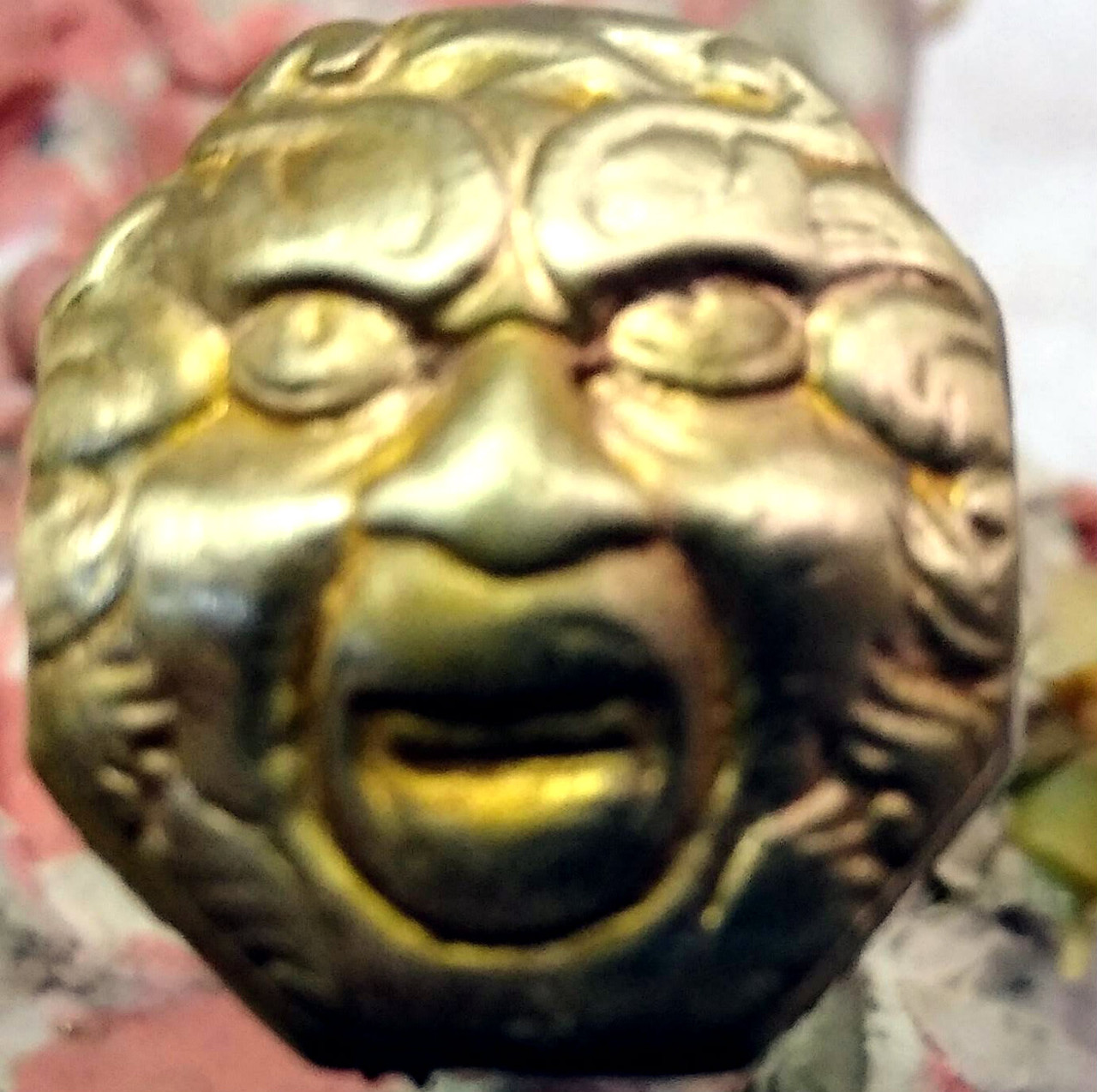 Grotesque mask buttplate